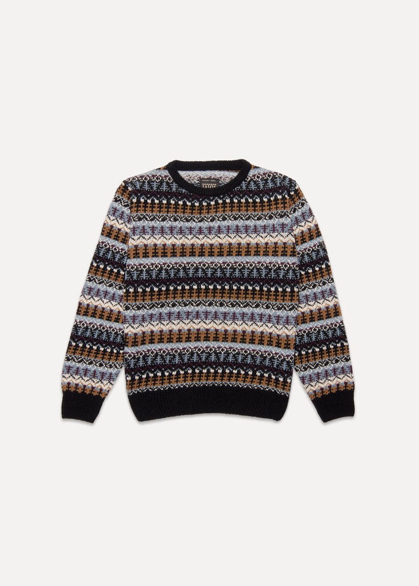 El jersey Fernando es un jacquard tipo Gansey de tonos azules y beige. Los puños y cuello son de color negro. Es un diseño muy bonito y clássico, con un aire nórdico y navideño