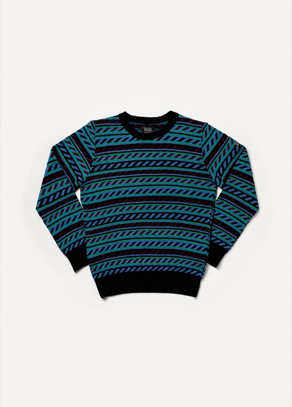 Jersey IAIOS unisex jacquard en azul, verde y negro, moda sostenible, fotografía en plano (flat lay), hecho en Catalunya (España) con hilo reciclado.