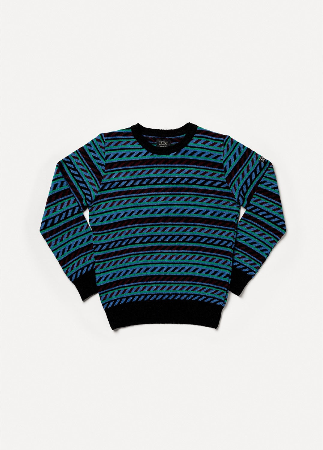 Jersey IAIOS unisex jacquard en azul, verde y negro, moda sostenible, fotografía en plano (flat lay), hecho en Catalunya (España) con hilo reciclado.