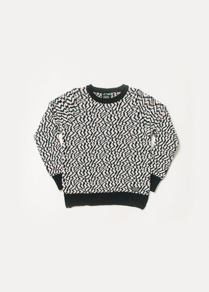 Jersey de mujer o unisex de color blanco y negro. Es un jacquard que imita unas manchas similares a las de la zebra