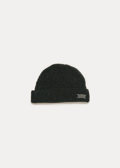 Black or dark gray beanie for winter. It is a basic and plain cap.