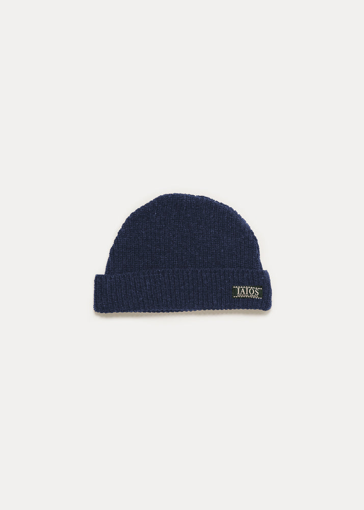 Dark blue plain knitted hat. The design is very basic.