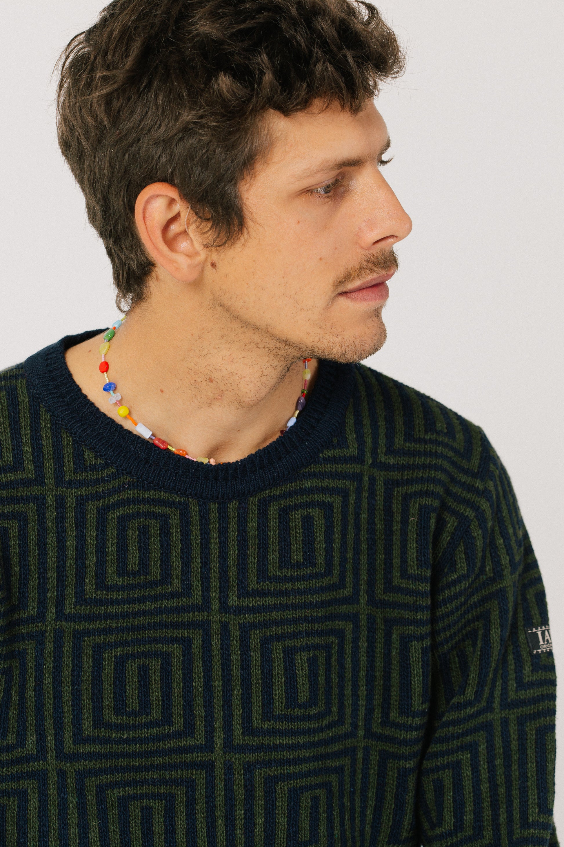 Detail of the model and the collar of the sweater