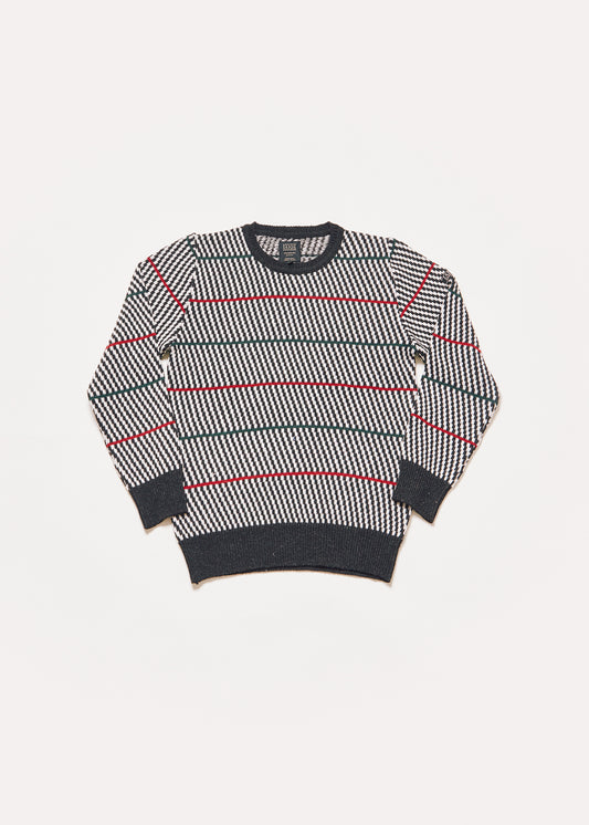 Men's or unisex knitted sweater with black and white diagonal stripes and green and red horizontal stripes that give it a modern touch. 