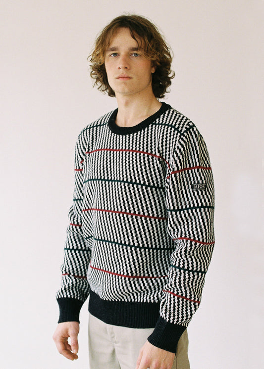 Half-length photograph of the model wearing the sweater.