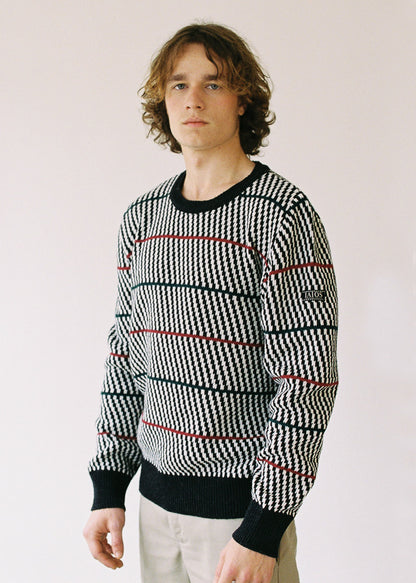 Half-length photograph of the model wearing the sweater.