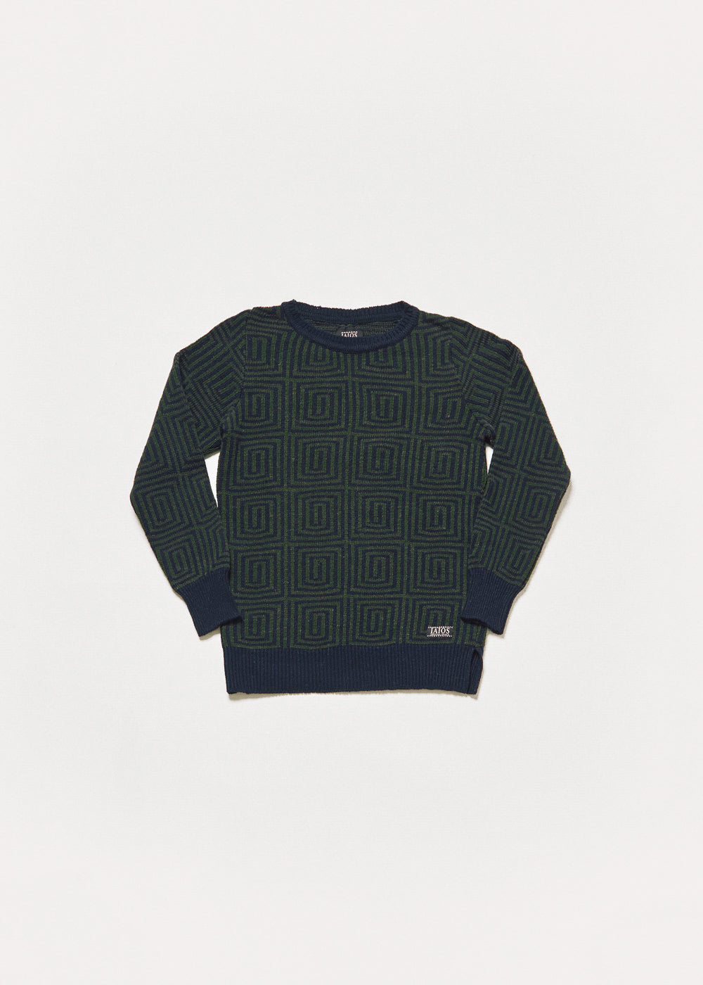 Jersey de mujer o unisex de color verde y azul oscuro. El diseño en espirales cuadrados.