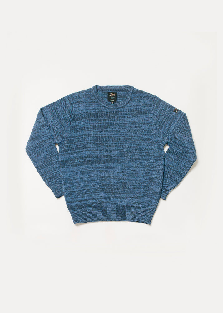 Jersey de hombre o unisex color rojo caqui con textura de torzal. El torzal es una técnica que torsiona dos hilos de diferentes colores en uno y que al tejerse hace un efecto jaspeado muy bonito. 