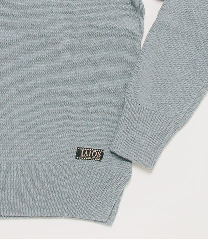 Detail of the sweater cuff. The plain sweater is one of the best sellers because of its simplicity.