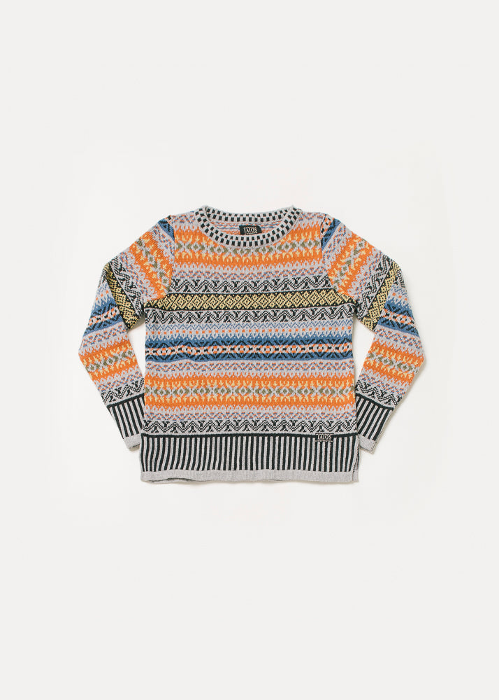 Jersey mujer de tonos naranjas grises y más. El jersey Salomon classic es especial porque tiene los puños y el cuello hechos con jacquard.