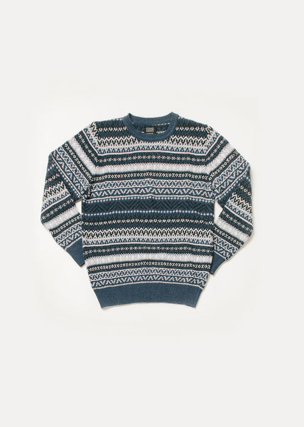 jersei de punt de home o unisex. Aquest jersei de tons blaus és un jacquard de 5 colors per la qual cosa s'aconsegueix un resultat de jersei molt nadalenc.